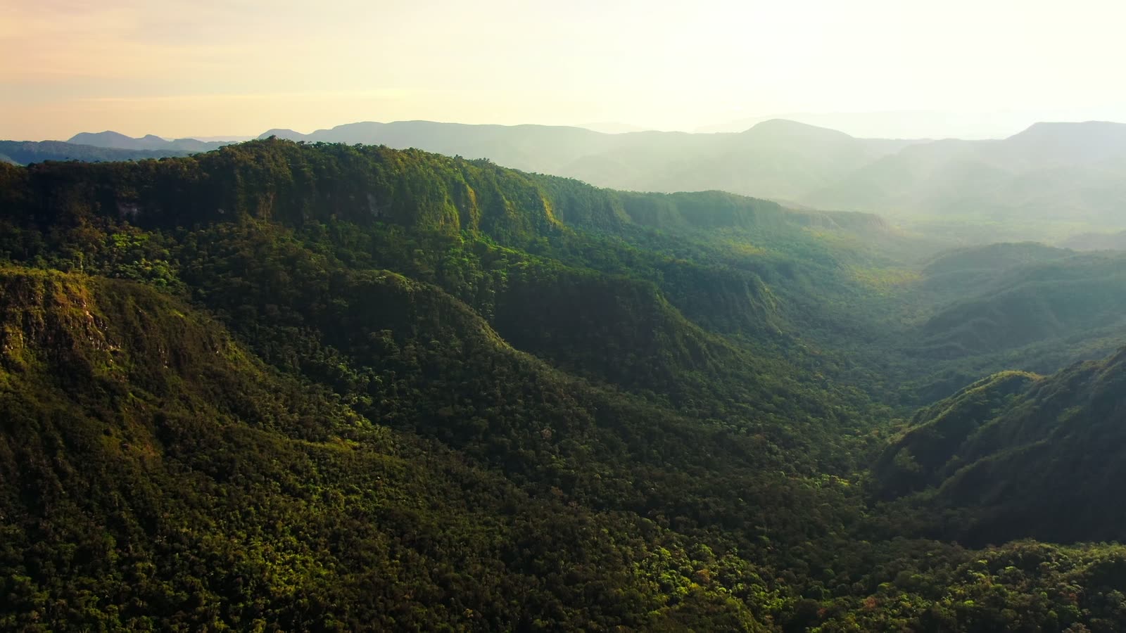 Aerial view of forested mountains and valleys in the Peruvian rainforest